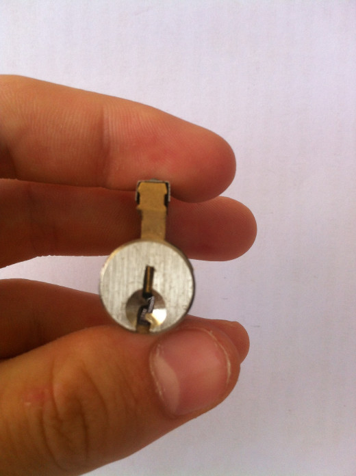 Have the lock facing upwards when you pick it, notice the small brass pins facing downwards when you look into the locks keyway. These are the Key Pins.