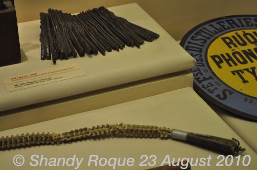 Above: The cards used by the French to collect taxes. Below: A whip that is made of animal bone.