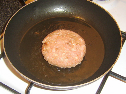 Starting to fry spicy pork burger