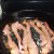Bacon frying in a skillet. Bacon frying in a skillet.