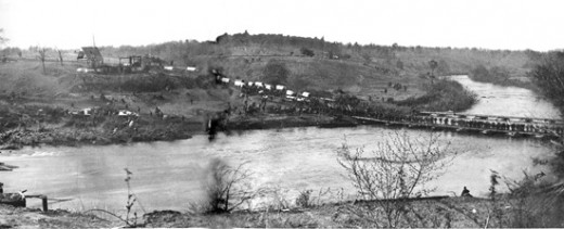 Infantry and supply wagons cross a pontoon bridge over the Rapidan River in Virginia. 