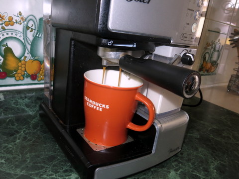 Next, the machine pulls 1-2 espresso shots.