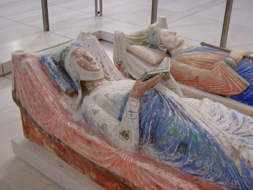 King Henry II (1133-1191) known as  known as Henry Curtmantle ("short" mantle),  or Henry Plantagenet and Eleanor of Aquitaine, Queen Consort of England (1122-1204). Final resting place at Fontevraud Abbey.