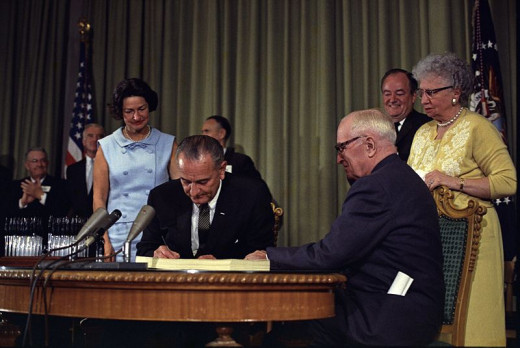 President Lyndon Johnson signing  the medicare bill at the  Harry S. Truman Library with Harry S. Trumen at his side on July 30 1965. He could not have predicted the high rate of Medicare fraud that exists today  