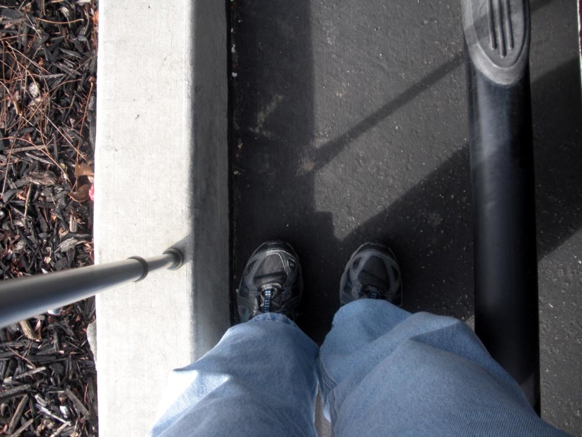With or without a cane, with the feet forced so close together, up against the vehicle on one side, the landscape curb on the other, balance can easily be thrown off