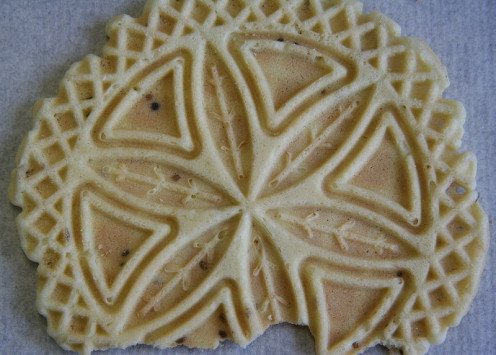 This is a picture of a Homemade  Anise and Vanilla Pizzelles that was made for people to enjoy. 