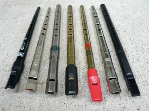 These are tin whistles, traditional Irish instruments. 