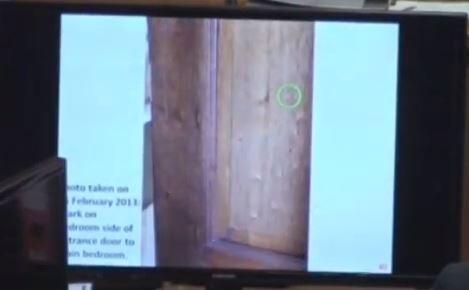 Pistorius bedroom door with a mark on it shown as crime scene photograph