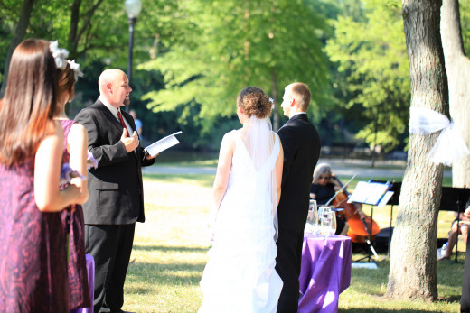 Saying our vows at our picnic wedding.