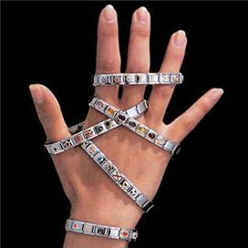 Italian Charm Bracelet in five different sizes on a hand with a black background