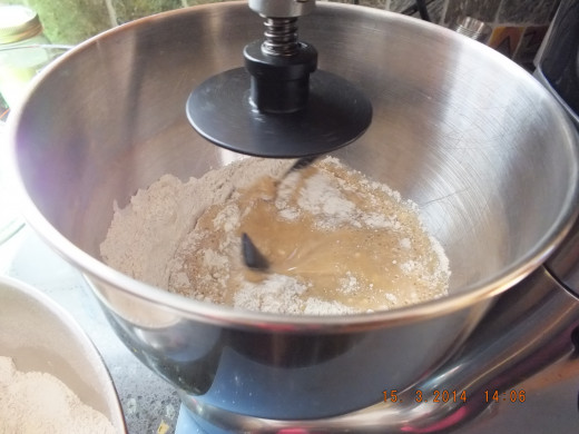 Once all the flour is in the mixer and wet, go ahead and start; turn the mixer up around medium high. Don't go too high or your mixer will "walk" off your counter. That could get expensive!