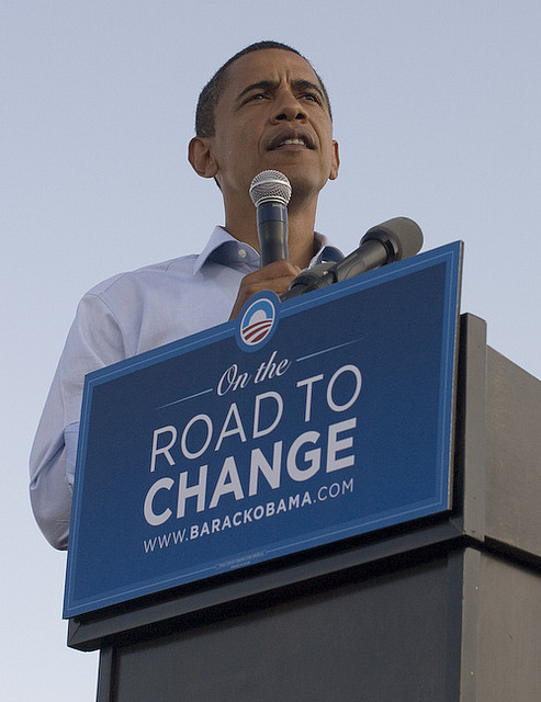 Barack Obama standing behind "Road to Change" podium