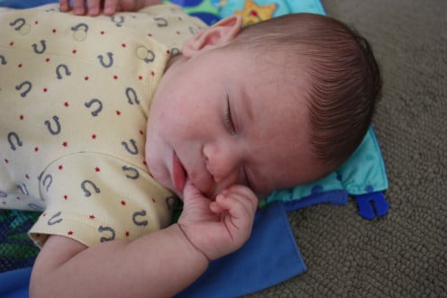 A baby sucking the thumb