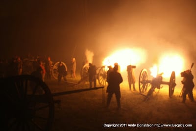Living Historians fire cannon at night