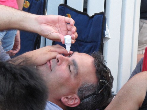 Man Applying eye drops