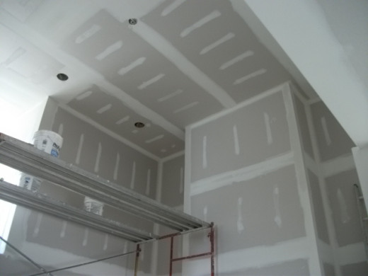 Drywall work in progress in construction of new home.