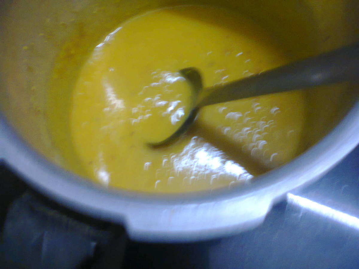 cooked dal being mixed