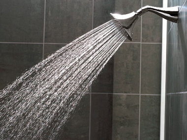 Showering generally uses much less water than a bath. Buy a low flow shower head to really save money!