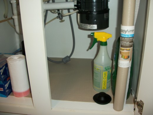 Cupboard under the kitchen sink is lined to protect against any possible leaks in the future. Same with the bathroom cupboard as shown below. These liners come in all colors and patterns.
