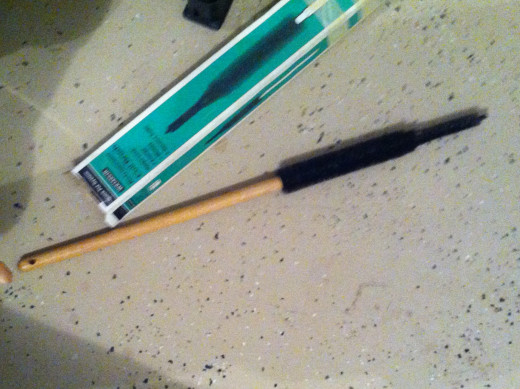 Brush for under refrigerator cleaning