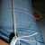 Tie the core cord to a belt loop.  Tie it tightly so that it holds tension and doesn't come off.