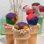 Mini rainbow cupcakes can be enjoyed in so many ways, like topping them on ice cream cones.