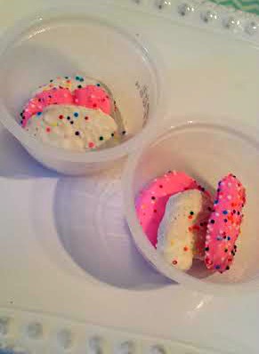 You can serve these rainbow-sprinkled circus animal cookies in individual containers for easy party snacks.