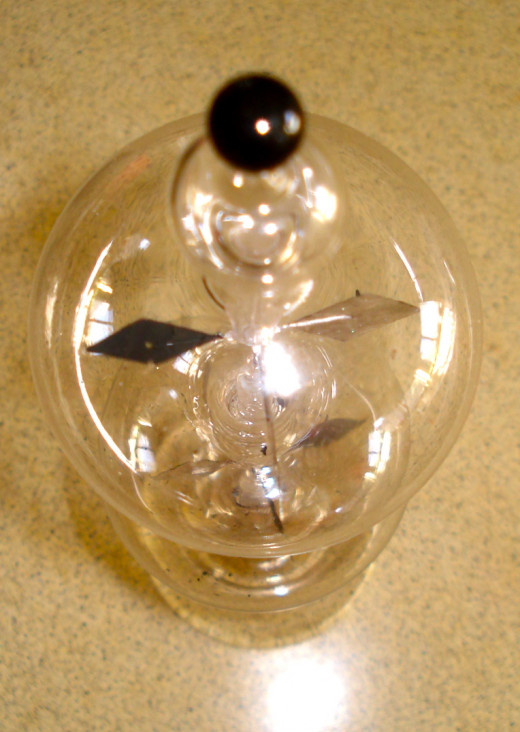 The upper globe showing the decorative knob.