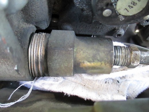 Unscrew the large nut...