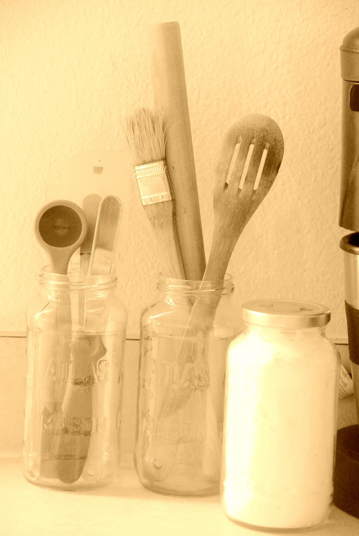 Hold kitchen utensils in jars and use them as food storage for things like sugar and flour.