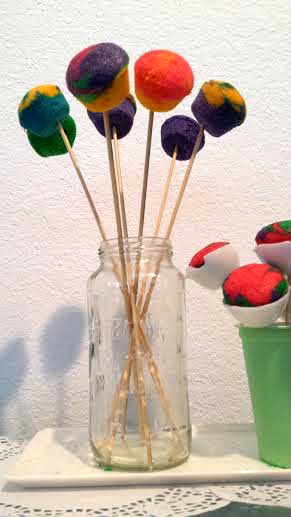 Jars are useful to hold food like cake pops on the table.