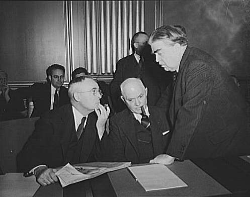 War Labor Board Anthracite Hearing (1943). John L. Lewis (right) confers with Thomas Kennedy (left),  UMW Secretary-Treasurer, and Pery Tetlow (center) UMW District 17 President.  Photo taken at the War Labor Board.