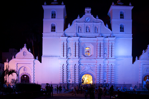 Facade of Cathedral of Saint Michael Archangel, at night with colored lights