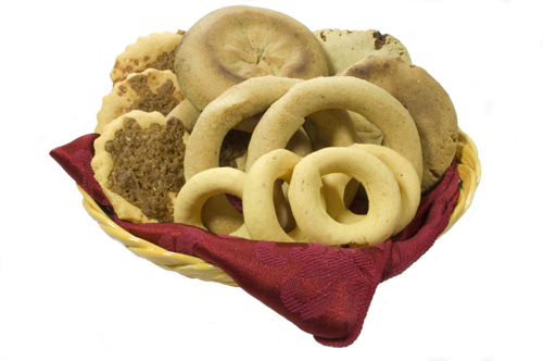 A basket of rosquillas, quesadillas and tustacas, local Honduran treats.