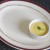 Turmeric and garlic dip is plated in a small ramekin