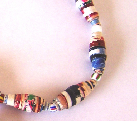 Close up of paper beads made from recycled magazines