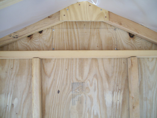 The hole for the rear vent was marked, drilled, and cut after the rear siding was installed.