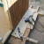 Installing the first piece of siding on a side wall. Installing the first piece of siding on a side wall.