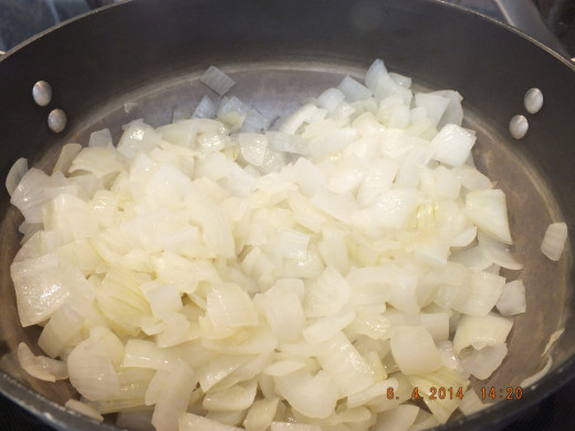 The onions are becoming translucent--they will start to carmelize now.