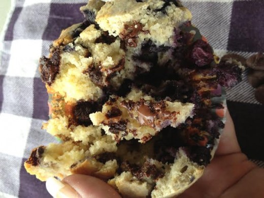 The inside of these muffins is bursting with chocolate and blueberries.