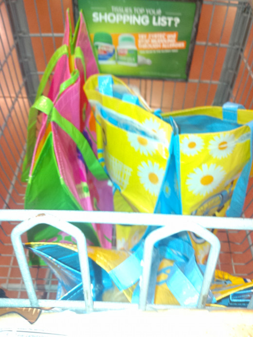 Begin by placing three large reusable bags in your grocery cart.