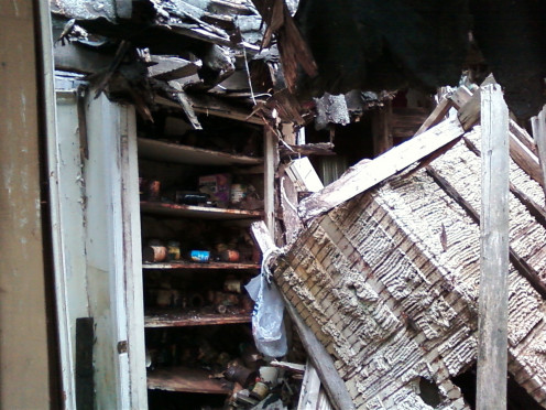 These photographs are from the rear of the house where the roof caved in on the kitchen area.