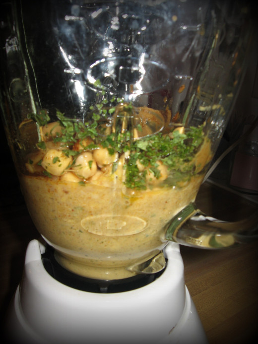 Since this is a blender recipe it takes a bit more time.  If you have a food processor it will go much more quickly!  Stir.  Blend for a minute. Repeat for about 5 minutes.  If needed, thin your hummus with more olive oil, water, or lemon juice.  