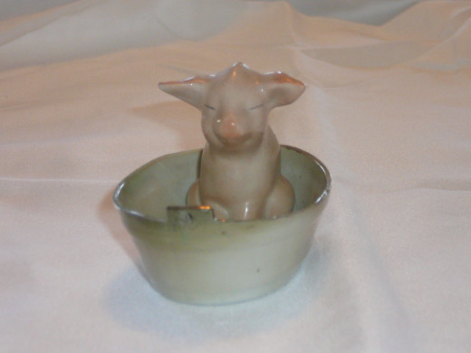 Pig in a tub. 3 1/2" x 3 1/2". Paid $41 on ebay. Common