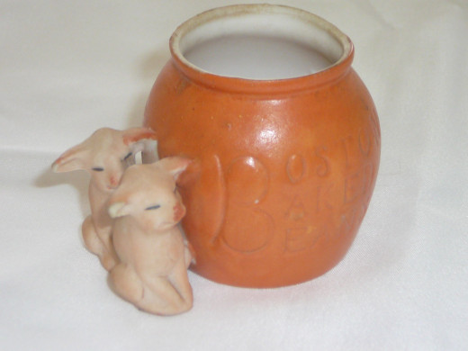 Boston Baked Beans. These are fairly common and come with a green or orange pot.  Featured in "This little Piggy" its 1992 value was $60 - $10 less than the green pot. 3" x 2 1/4". Paid $35. Common