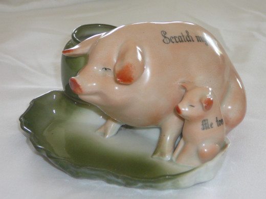 This particular striker reads "Scratch my back" and the baby reads "me too". There is a similar version of this featured in "This little Piggy" but it had one pig with a pot. Its '92 value was $210. 5" x 2 1/2". Paid $36. Rare.