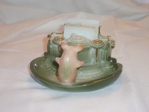 This cute little secretary is beginning to type out her letter "Gentlemen". This is the only one I've seen with the gilded inscription - added in America.   Featured in "This little Piggy" its '92 value was $170. 4 1/4" x 3 1/2". Paid $97. Rare.