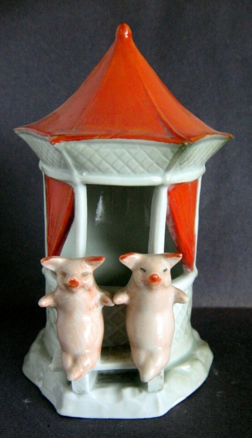 This lovely gazebo featuring 2 pigs with a beautiful red roof and curtains just sold on ebay for $141. I've only seen this figure come up for big one other time. Rare.