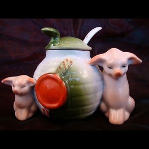 This lovely mustard pot comes with a crochet rouge on the front, a lid and a tiny spoon that you could use to dip out your mustard. Flanked by two pigs it's a really nice collectible. 4" x 3". Paid $61. Rare.