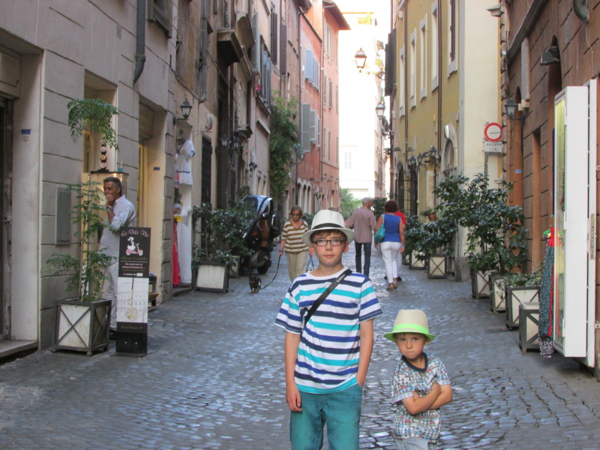 The children posing for a photo in the historic streets of Navona
